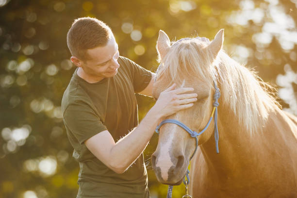 istock Man embracing of therapy horse 1778110925