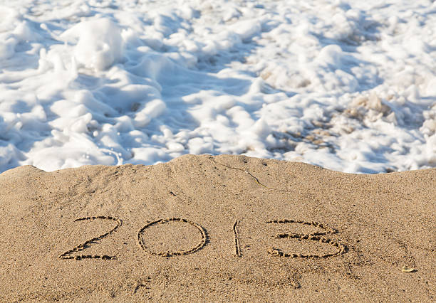 istock 2013 in sand being covered by sea waves 177811109