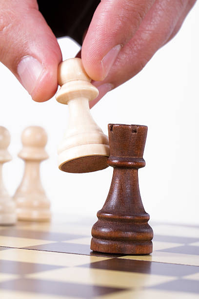 istock Hand Holding Pawn Against Castle 177811163