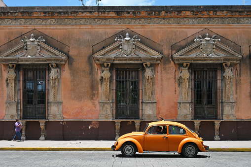 Merida, Mexico - July 20, 2023: Colorful colonial style buildings at street of Merida city old town, Mexico
