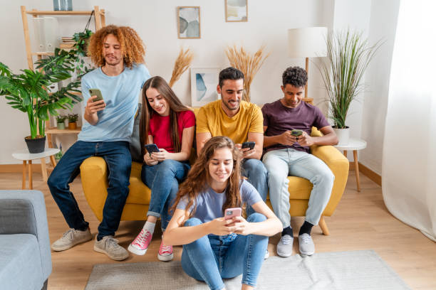istock multiethnic group of young people using mobile phones while sitting on sofa at home 1778116205
