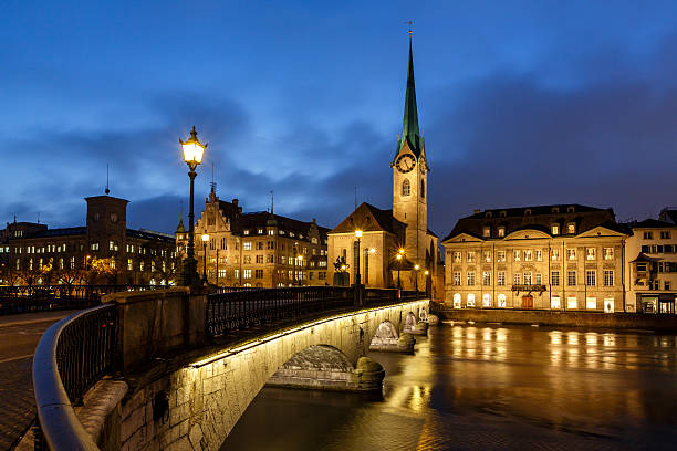 Illuminated Fraumunster Church and River Limmat in Zurich Illuminated Fraumunster Church and River Limmat in Zurich, Switzerland switzerland zurich architecture church stock pictures, royalty-free photos & images