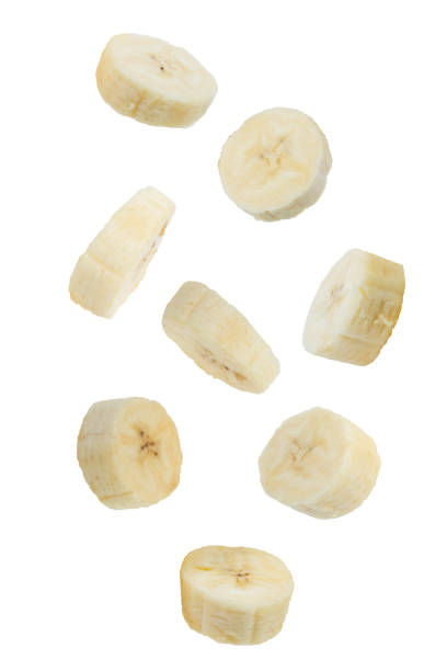 istock Flying fruits. Falling sliced banana fruit isolated on white background with clipping path as package design element. 1778121756