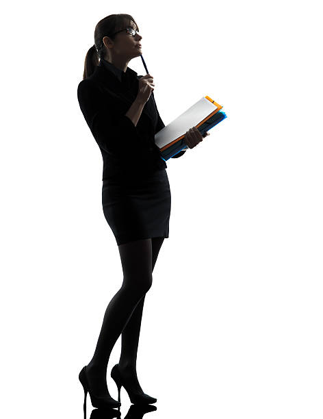 istock business woman  thinking holding folders files silhouette 177812490