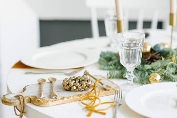 istock Christmas table setting. Classic decor with a wreath of Golden bells 1778126769