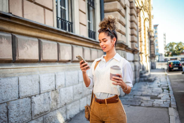 istock Young woman using phone in the city 1778131330