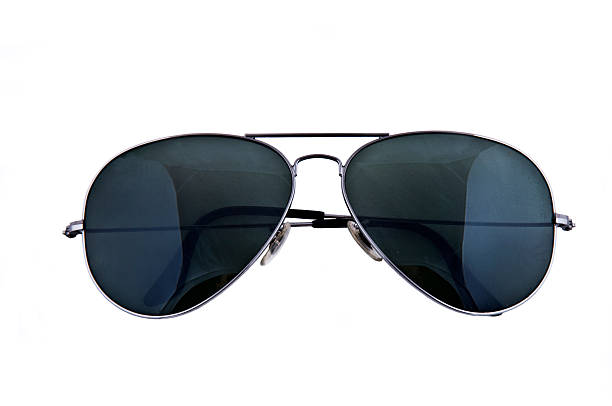 Close-up of sunglasses with black lenses against white stock photo