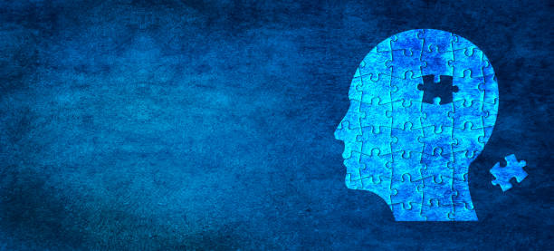 istock Human head shaped white jigsaw puzzle on abstract blue wall background 1778142740
