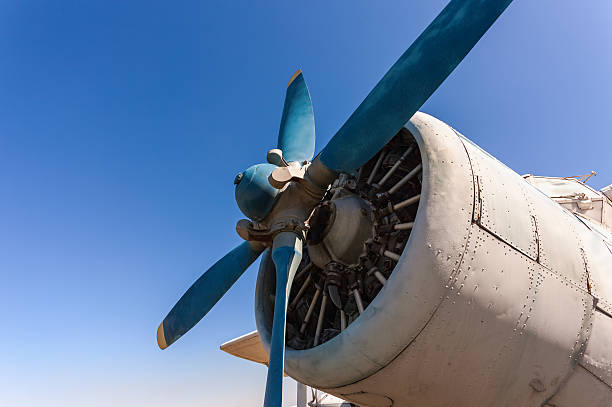 istock Propeller and engine of old airplane against blue sky 177814713
