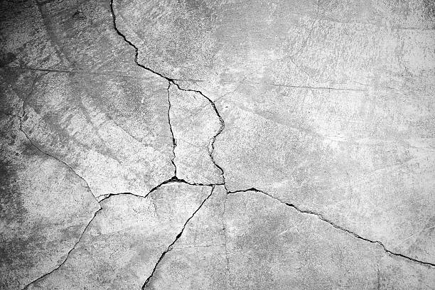 Grunge concrete cement wall Grunge concrete cement wall with crack in industrial building, great for your design and texture background cracked texture stock pictures, royalty-free photos & images