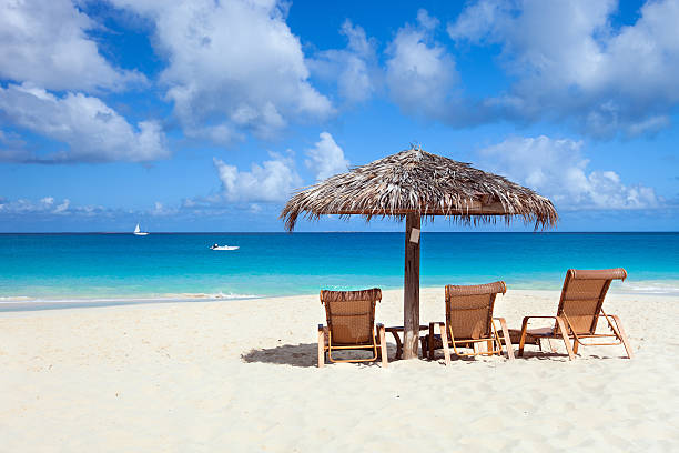istock Chairs and umbrella on tropical beach 177817639