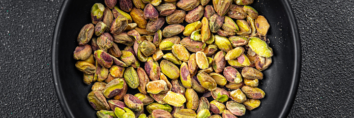 pistachios peeled without shell delicious nut delicious healthy eating cooking appetizer meal food snack on the table copy space food background rustic top view keto or paleo diet vegetarian vegan food