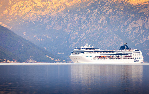 Kotor, Montenegro - September 21 2023: Lirica Cruise Ship is arriving to the Kotor Bay at sunrise.