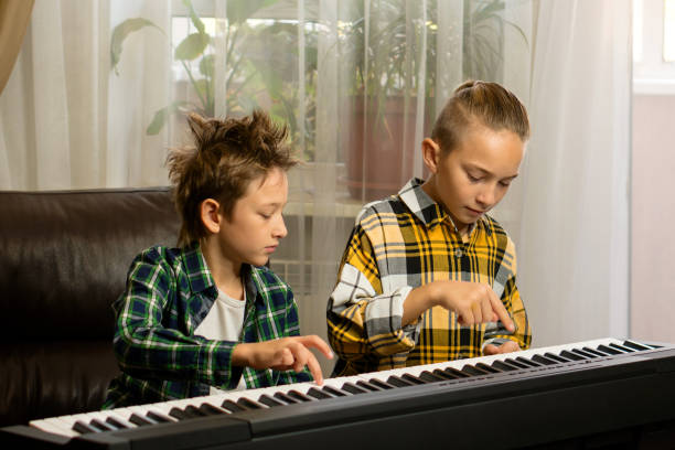 istock Brothers Sharing Piano Moments 1778187865