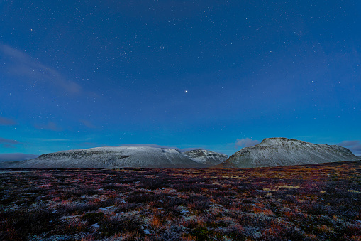 Very early morning starry sky over mountain range