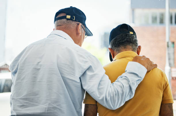 istock Help, back and men for support, conversation and comfort in retirement for depression. Anxiety, kindness and friends or people with a discussion, talking or a problem together with empathy and sad 1778190744