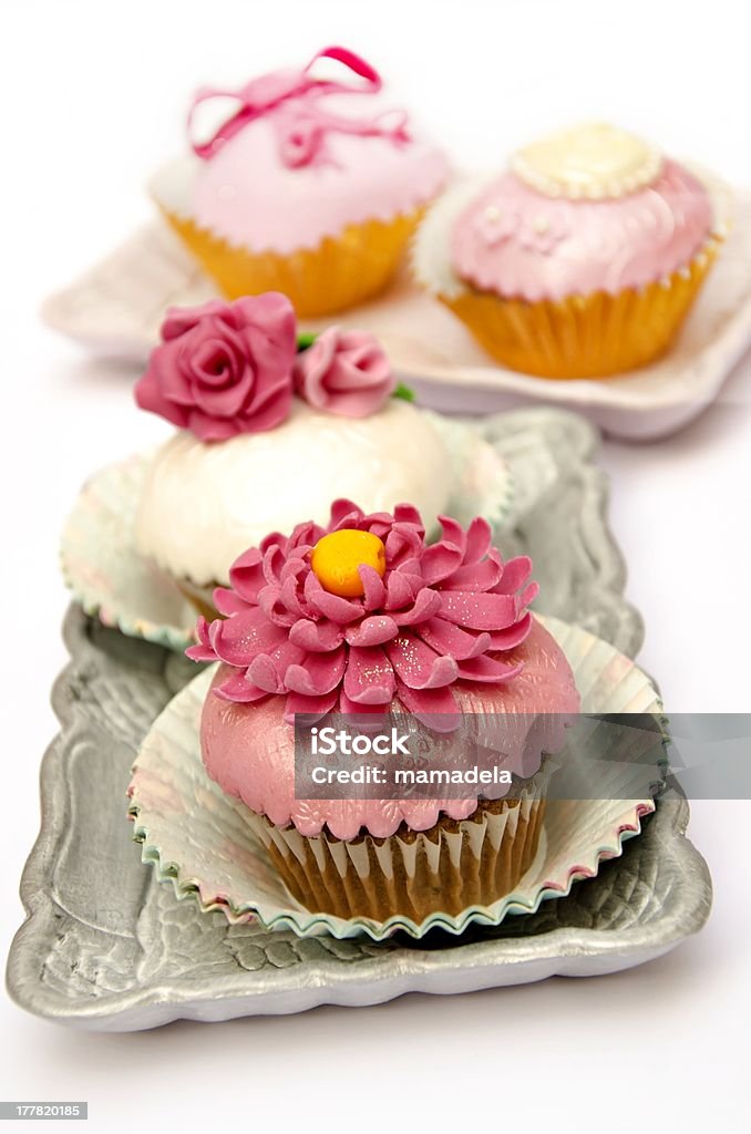 Cupcakes Cupcakes decorated with fondant and sugar flowers Baked Pastry Item Stock Photo