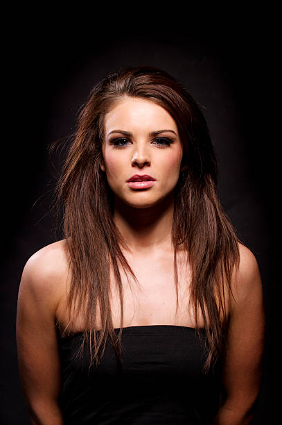 istock Beautiful brunette woman on a black background 177820410