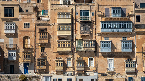 Malta is well-known for its beautiful balconies, which are a staple feature of the island’s architecture. Maltese balconies are believed to have originated in the 16th century, during the period of Ottoman rule. During this time, many buildings in Malta were constructed with large projecting balconies that served as a sunshade and a place to socialize. These early Maltese balconies were often ornate, with intricate metalwork and colorful tiles.