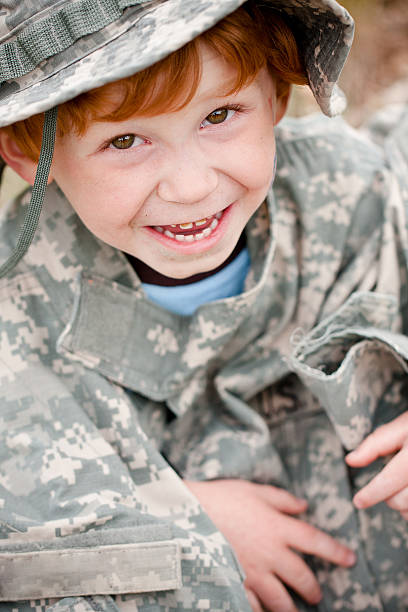 Child in Army uniform stock photo