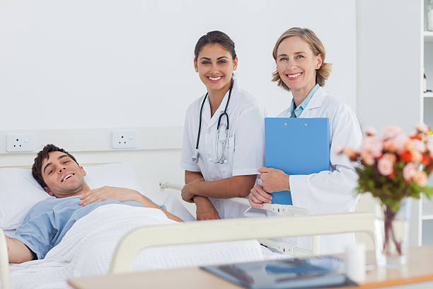 istock Patient and doctors looking at the camera 177821555