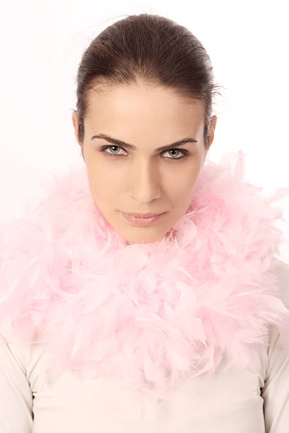 istock Beauty face looking at camera, with boa feather, isolated 177822750