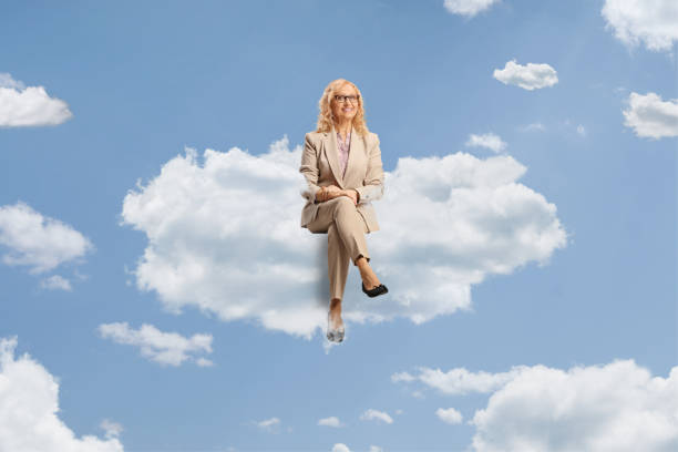 istock Professional mature woman with glasses sitting on a cloud 1778227679
