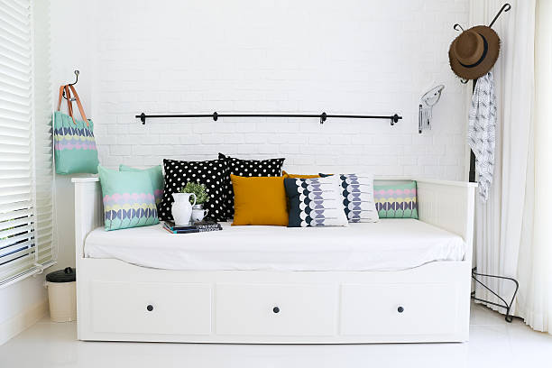 istock Colorful pillows on a white sofa with white brick wall 177822796