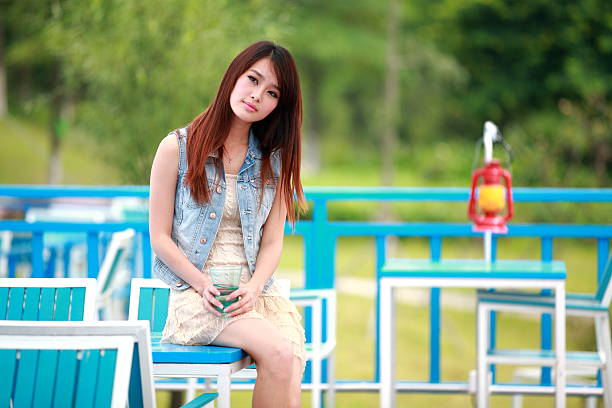 Single asian young woman with looking away.