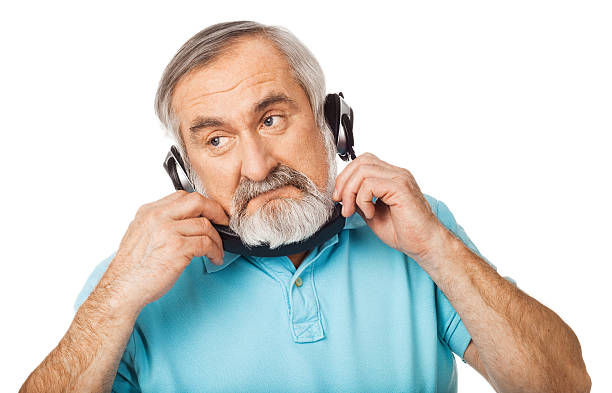 istock Old guy holding the headphones 177823636