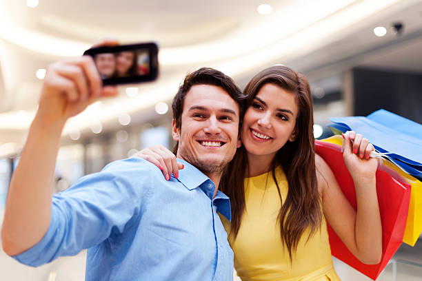 istock Happy couple taking  photo during a shopping 177823901