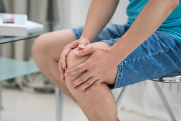 istock Knee pain, man suffering from ache and doing self-massage at home 1778240506