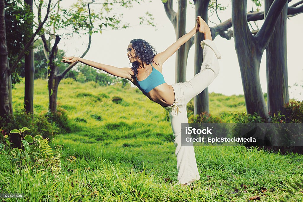 woman practicing yoga beautiful radiant woman practicing yoga nature Activity Stock Photo