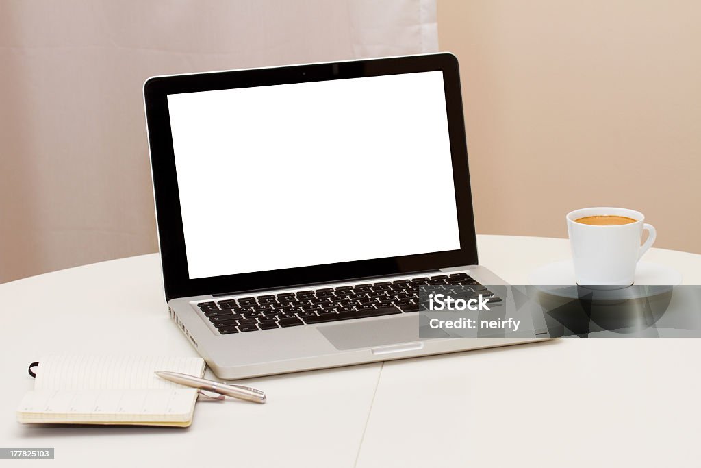 Working from home with laptop notebook and mug of coffee Working at home - open notebook, copy space on display Black Color Stock Photo