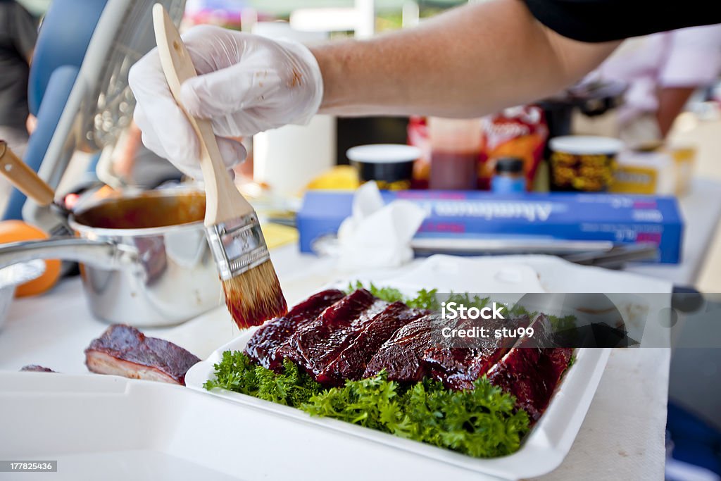 BBQ ribs BBQ ribs being glazed in sauce as part of a competition Barbecue - Meal Stock Photo