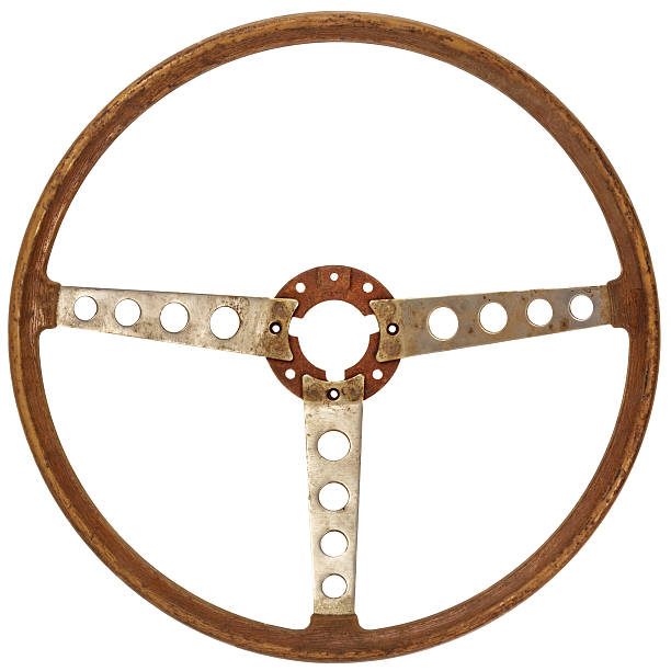 Antique wooden car steering wheel isolated on white Antique wooden classic car steering wheel isolated on a white background vintage steering wheel stock pictures, royalty-free photos & images