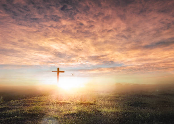 istock Christian wooden cross on sunset background. 1778270163