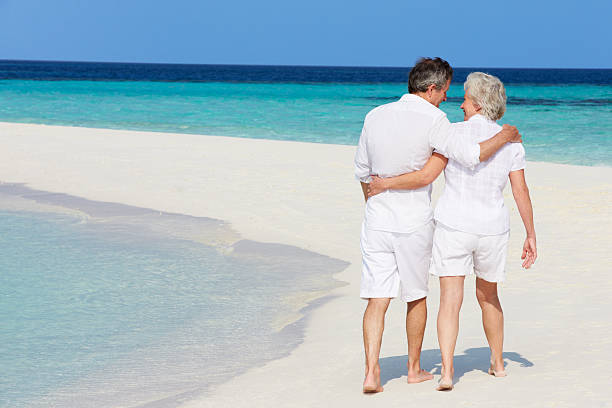 istock Senior Romantic Couple Walking On Beautiful Tropical Beach 177827284