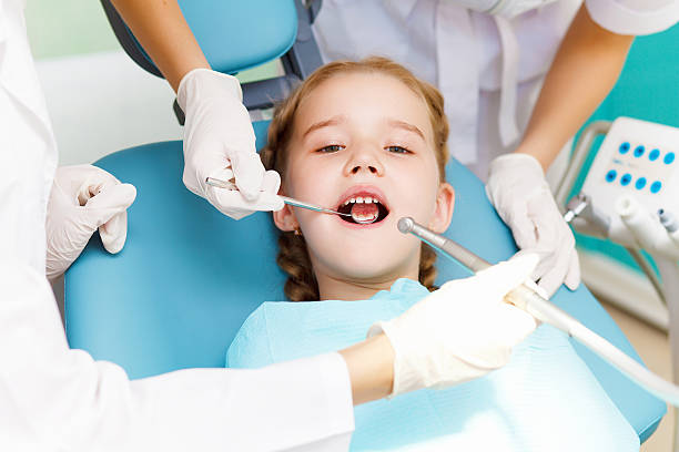 istock Little girl visiting dentist 177827299