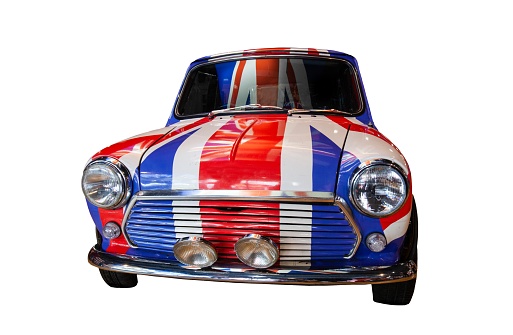 Historical retro British car painted in flag of the UK cut out and isolated on transparent white background.