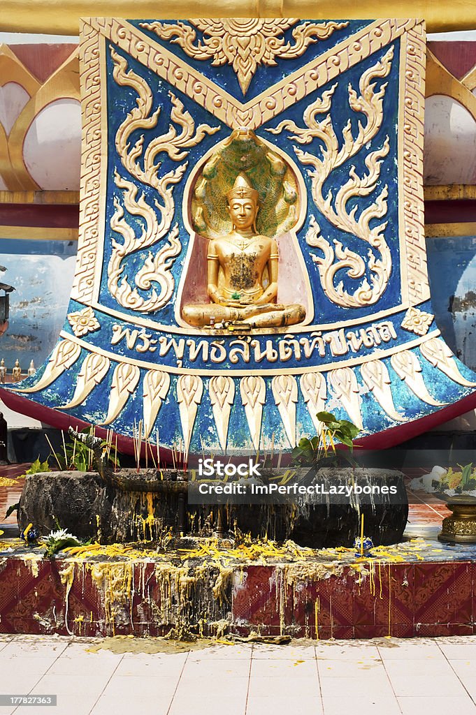 Golden statue of Buddha in meditation Golden statue of Buddha in meditation (Thursday) with offerings in Wat Phra Yai Temple. Koh Samui island, Thailand Architecture Stock Photo
