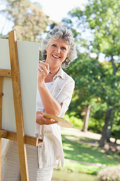 istock Woman painting is smiling at camera 177827378