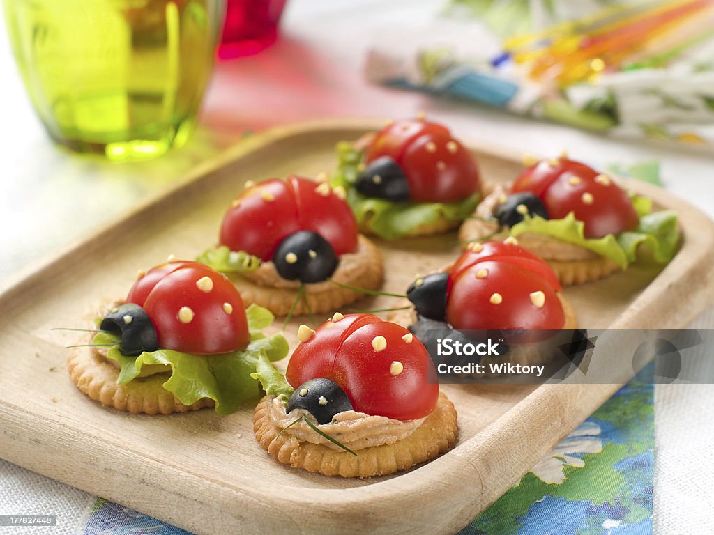 Appetizer Cracker with cheese and tomato for summer party, selective focus Appetizer Stock Photo