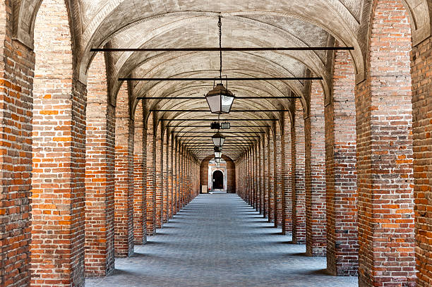 Sabbioneta (Mantua) - The Gallery Sabbioneta (Mantova, Lombardy, Italy) - The ancient building called The Gallery: a very long colonnade made with red bricks ancient arch architecture brick stock pictures, royalty-free photos & images