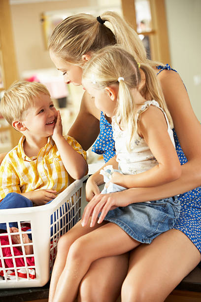 istock A mother and her children sorting laundry in the kitchen 177828268