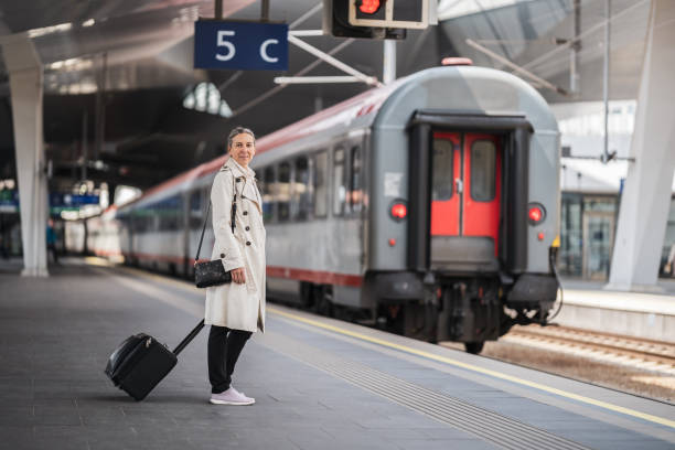 istock business woman at platform waitung for train 1778286764
