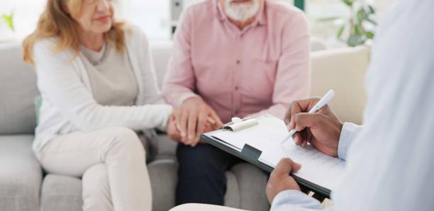 istock Holding hands, support and senior couple with therapist for counseling, help and support for difficult, crisis or cancer diagnosis. Therapy, depression and old people consulting mental health expert 1778290031