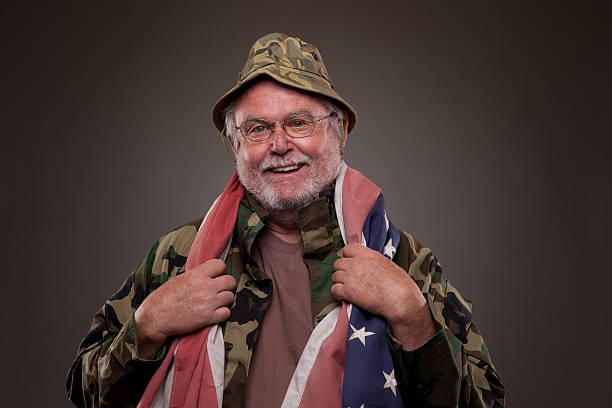 istock Smiling Vietnam Veteran with American flag 177830242