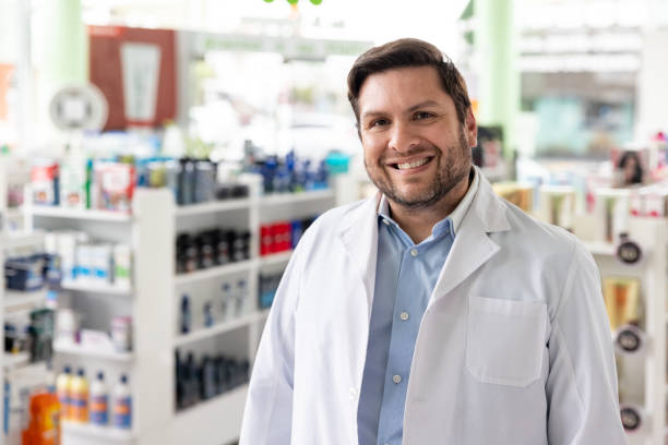 istock Happy pharmacist working at the drugstore 1778307361