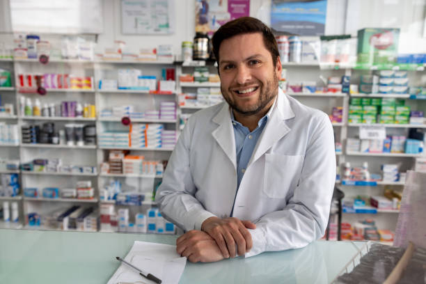 istock Happy pharmacist working at the drugstore 1778307363